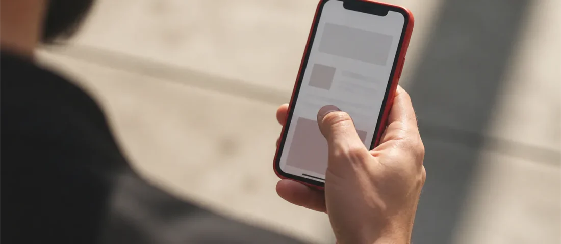 Thumb reaching across mobile screen