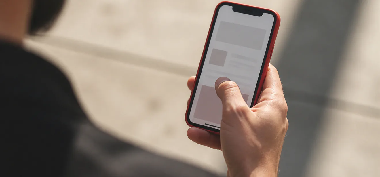 Thumb reaching across mobile screen